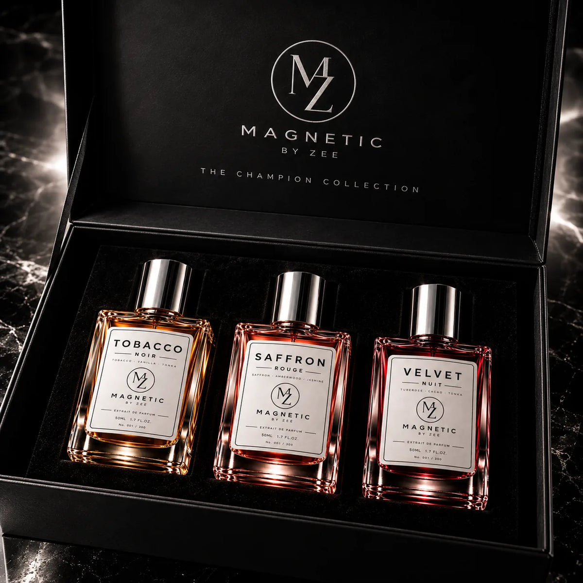 THE FULL COLLECTION by MAGNETIC BY ZEE: TOBACCO NOIR, SAFFRON ROUGE and VELVET NUIT Extrait de Parfum bottles in a black gift box